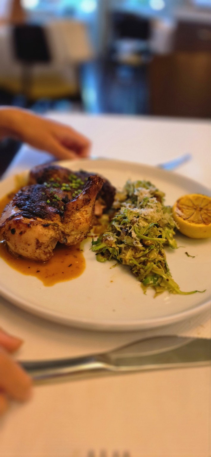 Brick-roasted chicken with shaved Brussels sprouts and charred lemon at Henry's Palm Beach