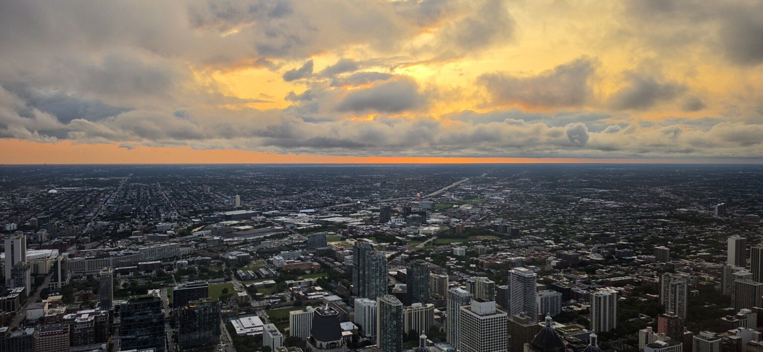A fiery orange sunset over Chicago viewed from 360 CHICAGO