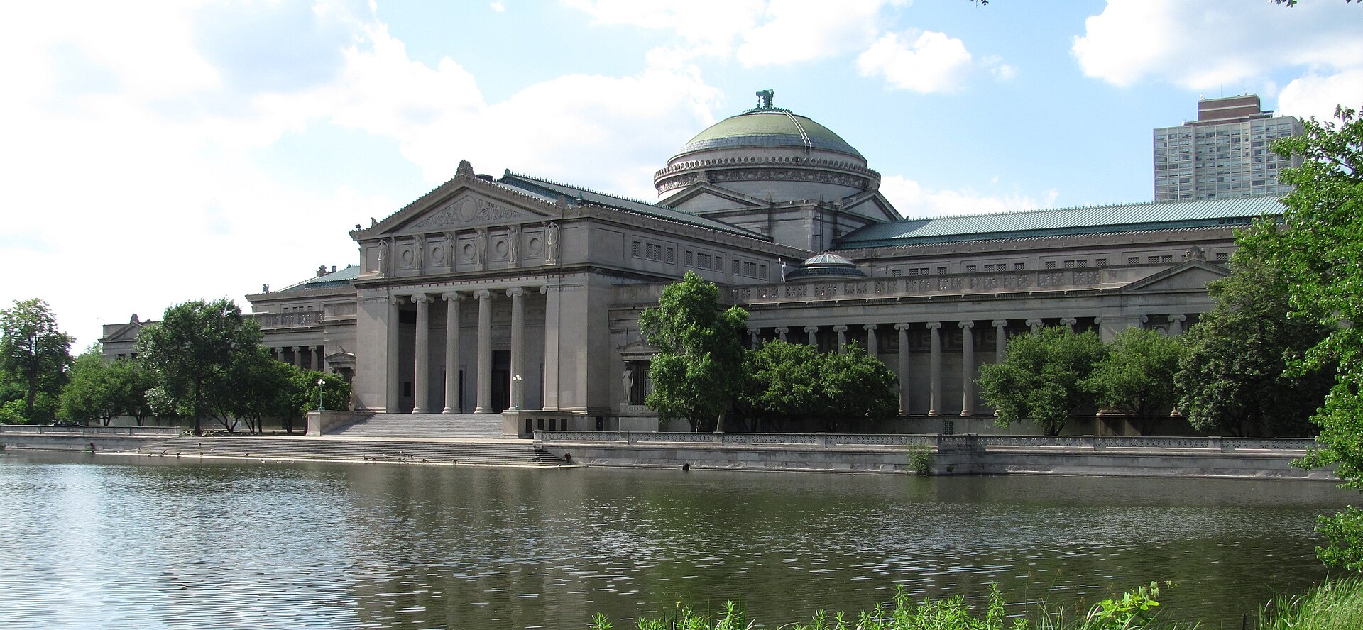 The neoclassical Griffin Museum of Science and Industry beside its reflecting lagoon in Chicago